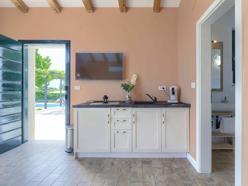 Cabinetry, Countertop, Tap, Building, Sink, Window, Plant, Plumbing Fixture, Houseplant, Bathroom Cabinet