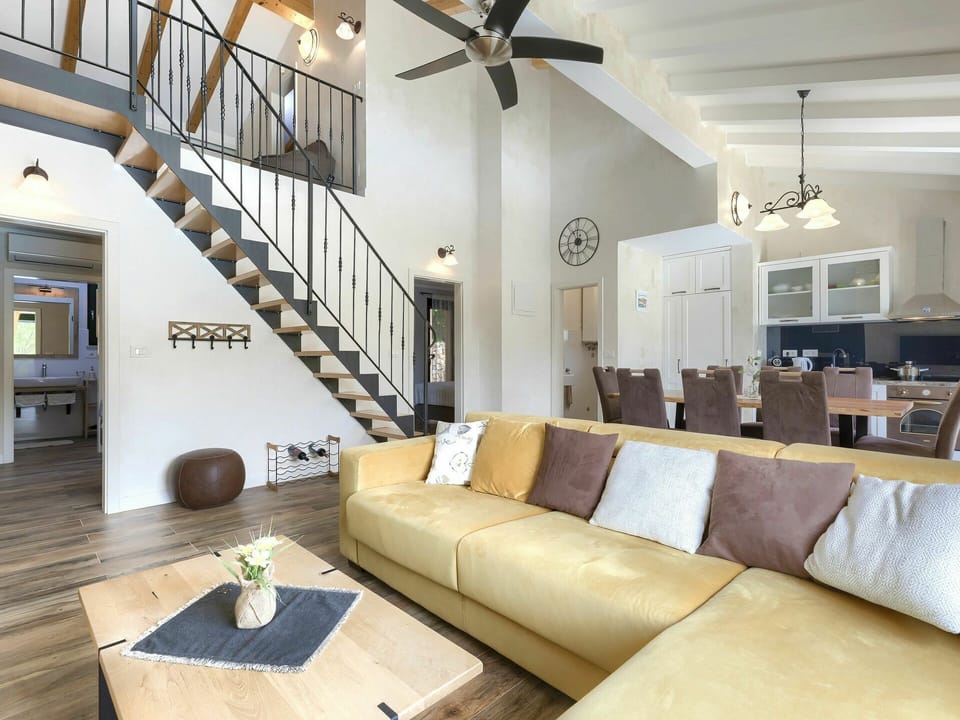 Table, Couch, Picture Frame, Property, Furniture, Wood, Ceiling Fan, Lighting, Studio Couch, Interior Design