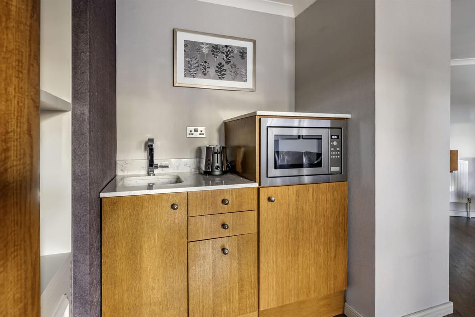 Suite, 1 Bedroom | In-room safe, blackout drapes, iron/ironing board