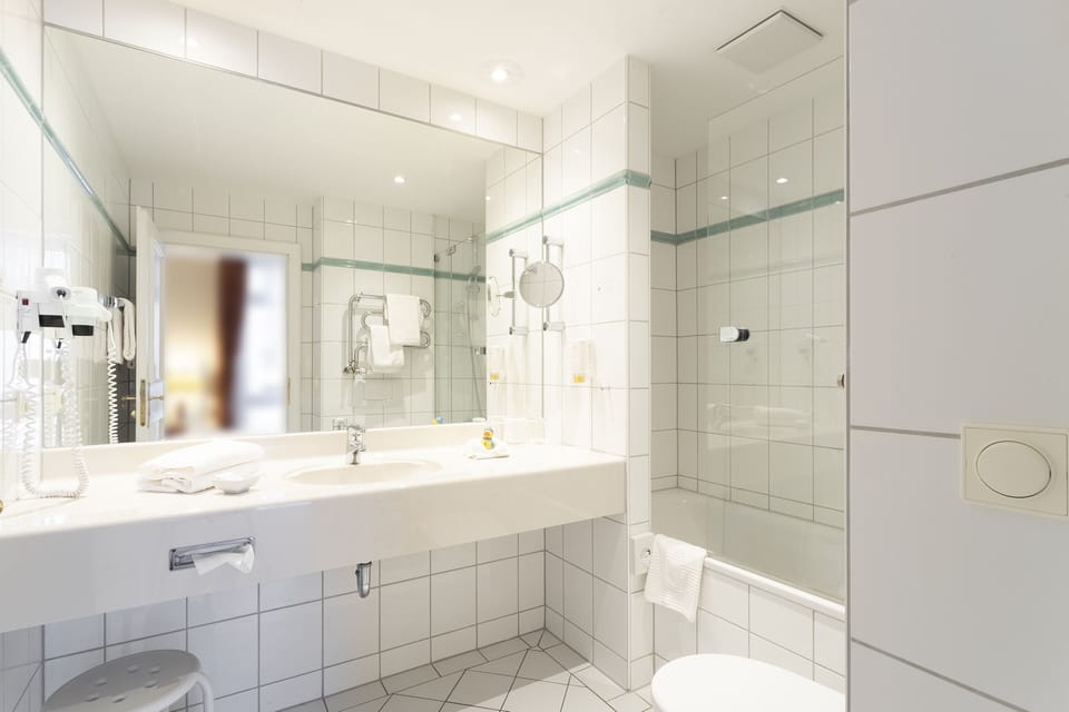 Suite, 1 Bedroom, City View | Bathroom | Eco-friendly toiletries, hair dryer, bathrobes, towels