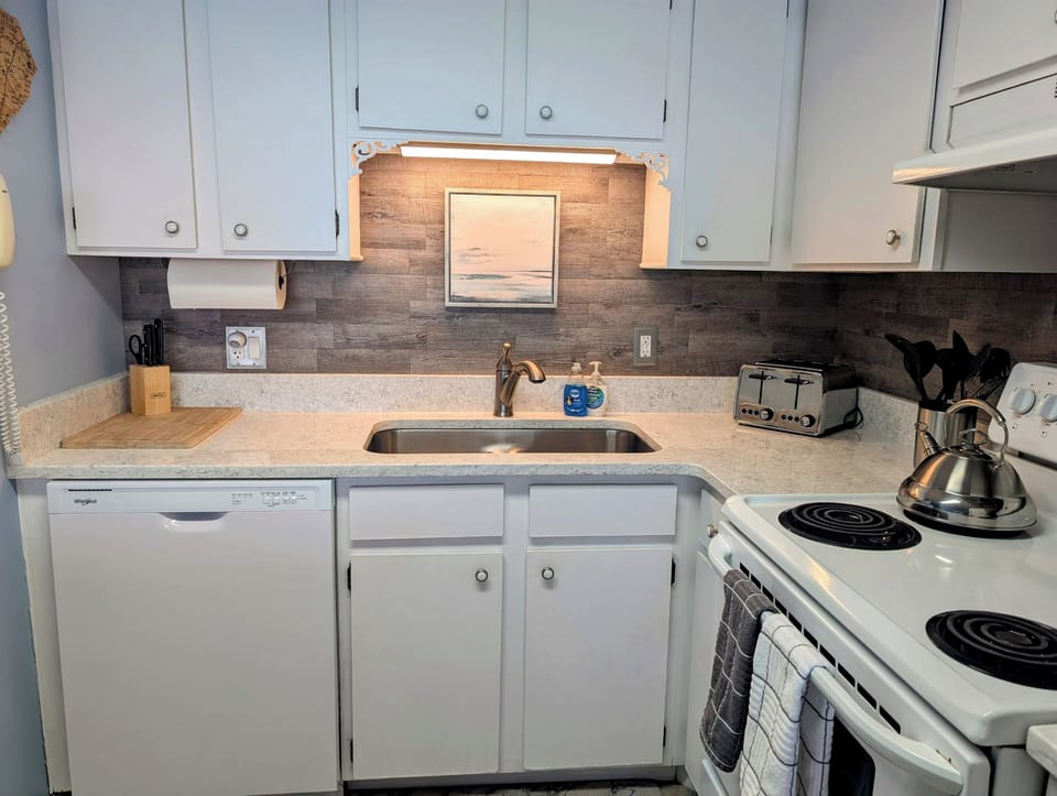Over sink lighting, dishwasher and stove