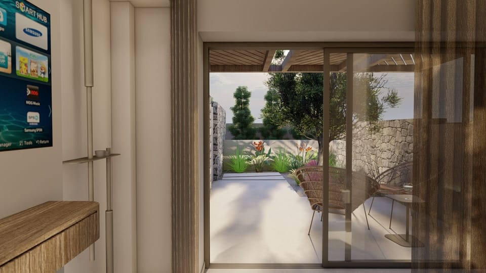 Deluxe Bungalow, Garden View | Living area | TV, books