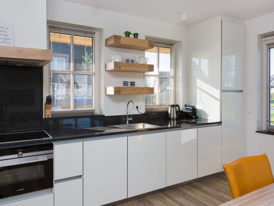 Villa | Private kitchen | Fridge, microwave, electric kettle, dining tables