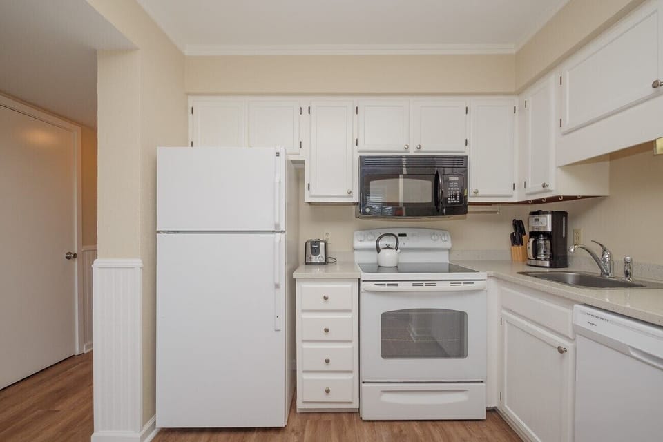 Carolina Beach Club 326 - Kitchen - Lovely bright white kitchen with all the appliances needed to make your vacation a breeze.