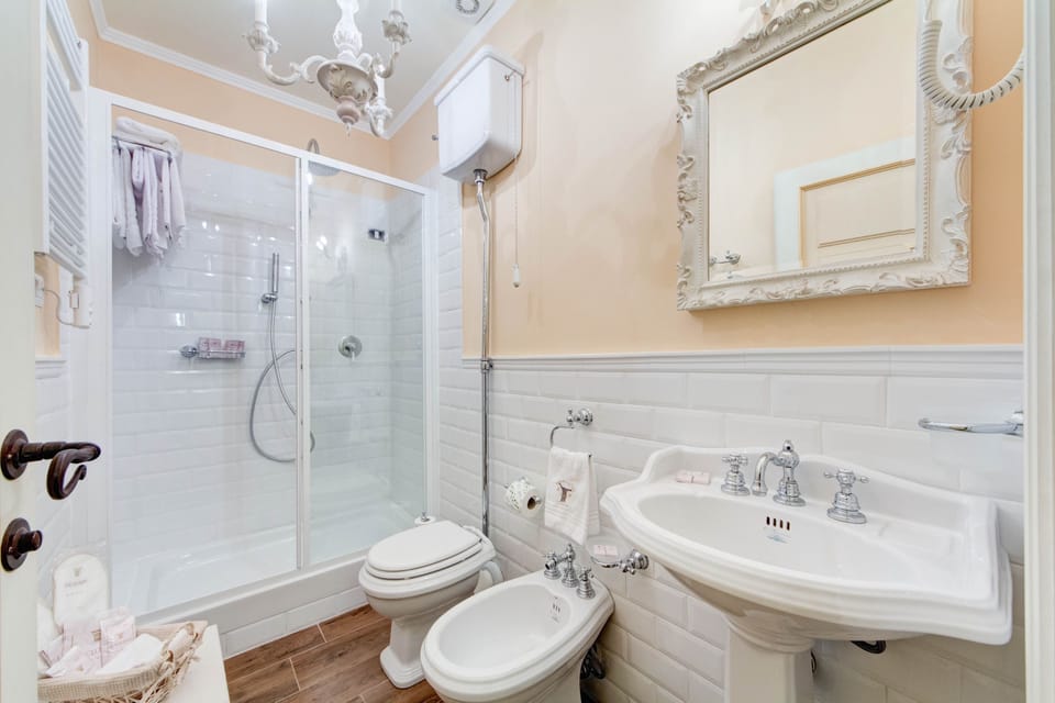 Luxury Suite, 1 Double Bed, City View | Bathroom | Shower, rainfall showerhead, designer toiletries, hair dryer