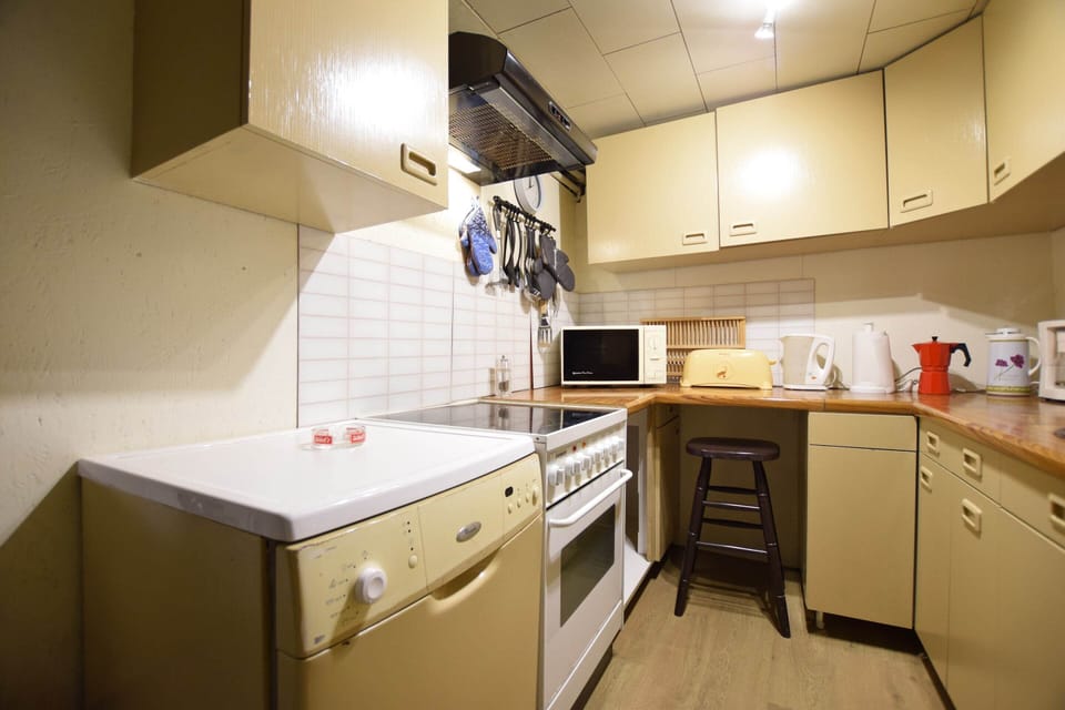 Cottage | Private kitchen | Microwave, highchair