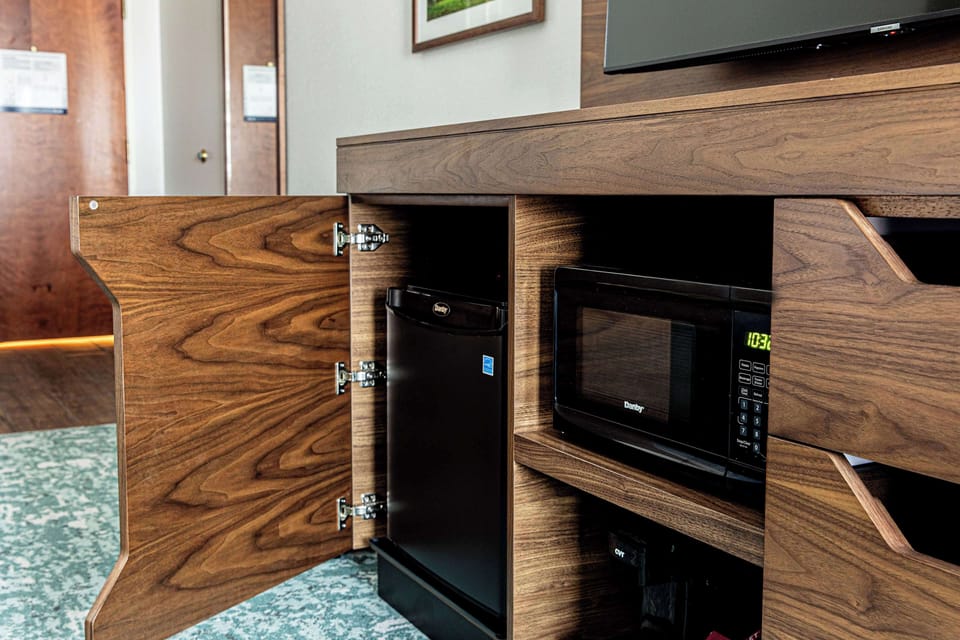 Down comforters, pillowtop beds, in-room safe, blackout drapes