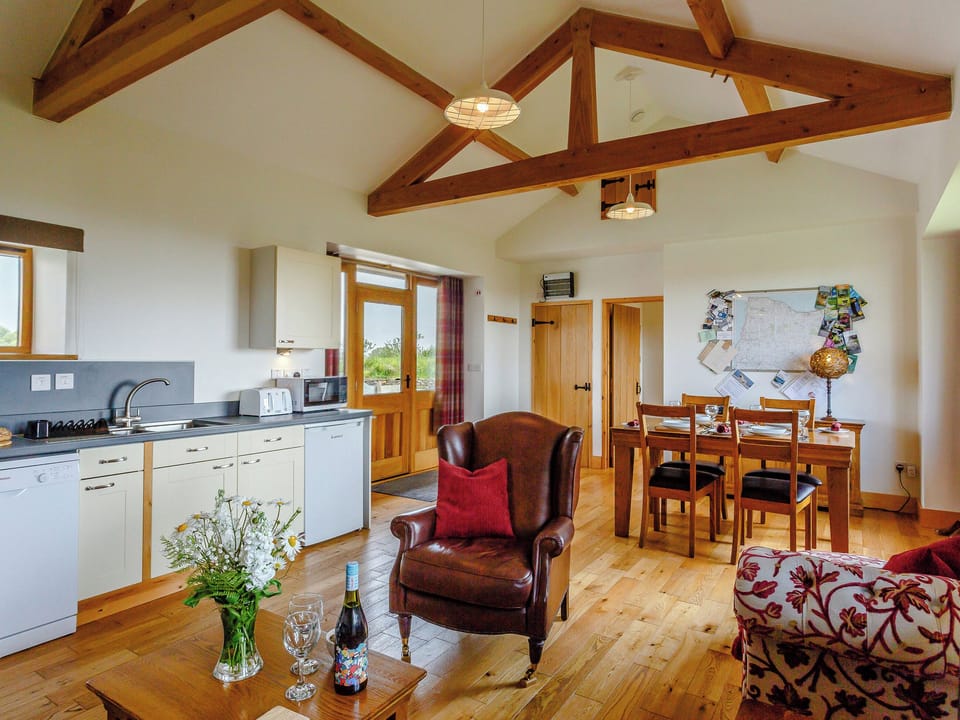 Exposed wood beams throughout the living areas | Threshing - Hartland Holiday Barns, Woolsery, near Bideford