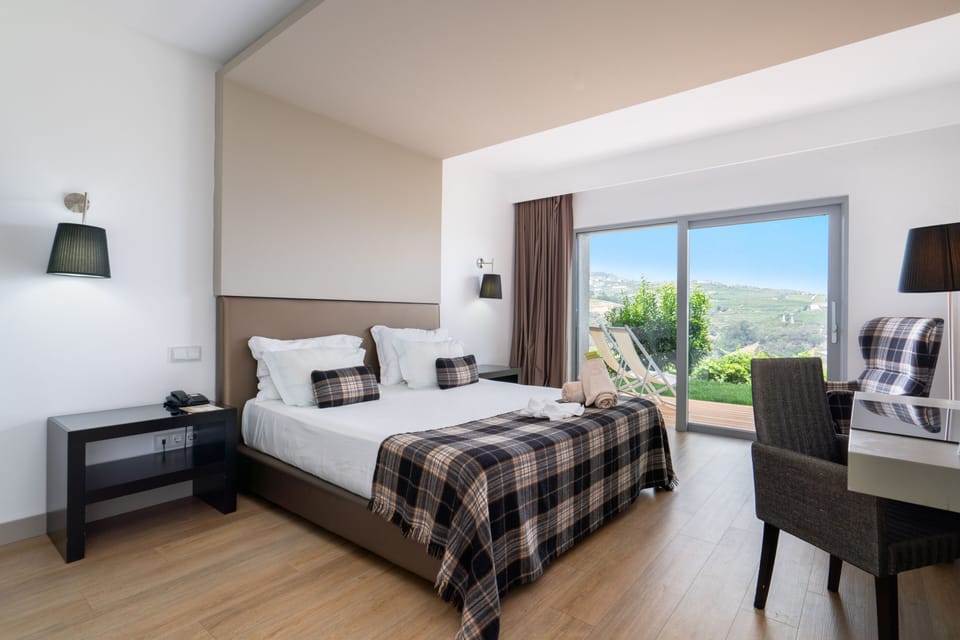 Deluxe Double Room, 1 Double Bed, River View | Minibar, in-room safe, desk, blackout drapes