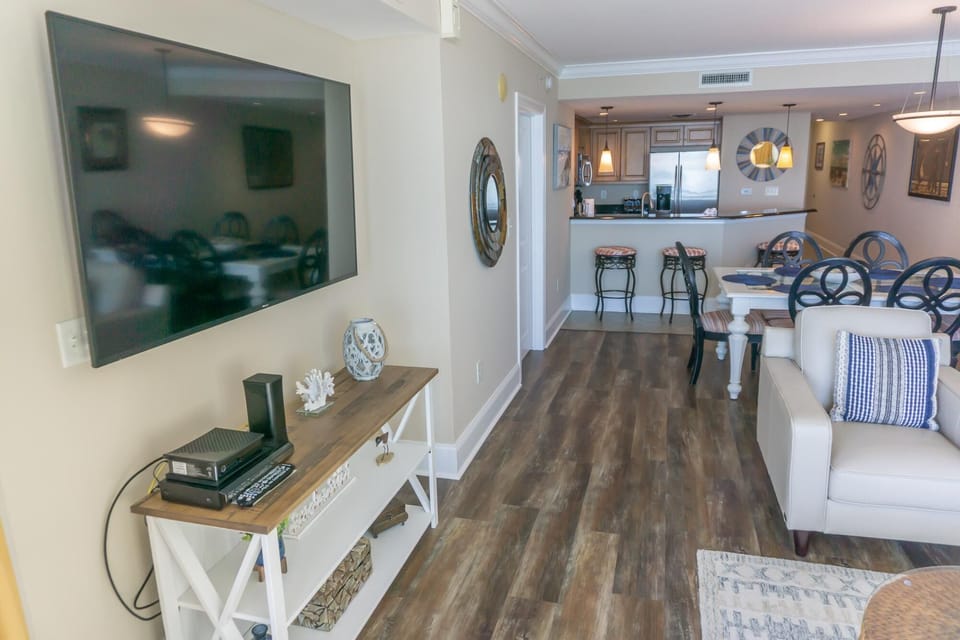 Spacious living room with cozy seating and modern entertainment