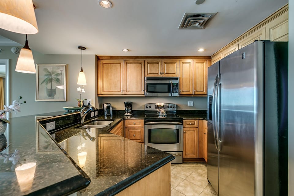Modern kitchen with granite countertops and stainless steel appliances