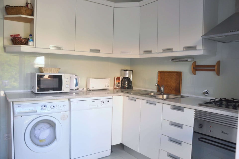 Villa | Private kitchen | Microwave, stovetop, coffee/tea maker, highchair