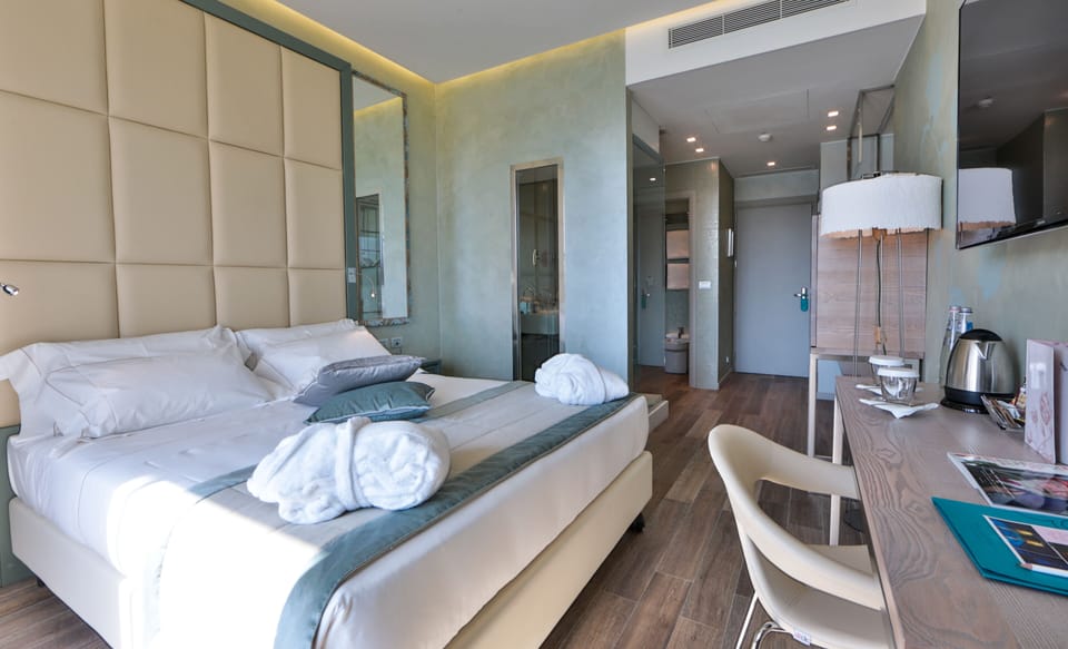 Deluxe Room, 1 Double Bed, River View | Bathroom | Eco-friendly toiletries, hair dryer, bathrobes, slippers