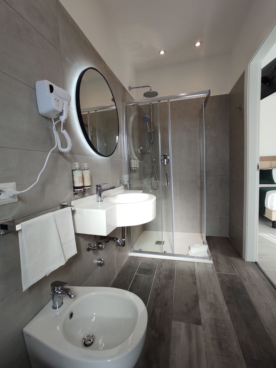 Deluxe Double Room | Bathroom | Rainfall showerhead, eco-friendly toiletries, hair dryer, bathrobes