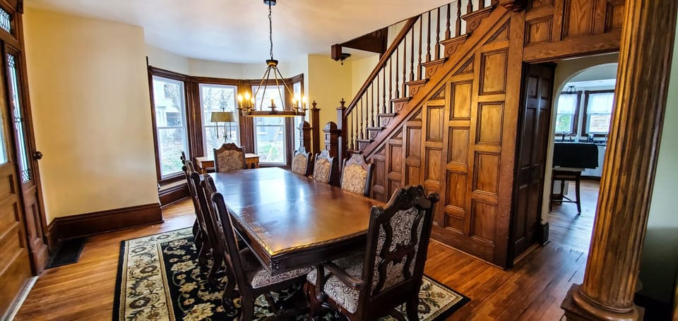 Dining Area - Main Level. Another view of the gorgeous wood accents and windows that make The River House extra special.