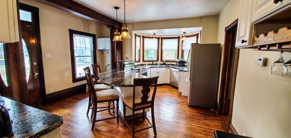 Kitchen Area - Main Level. Kitchen area with kitchen bar and seating for 4. It a great area to socialize while preparing meals.