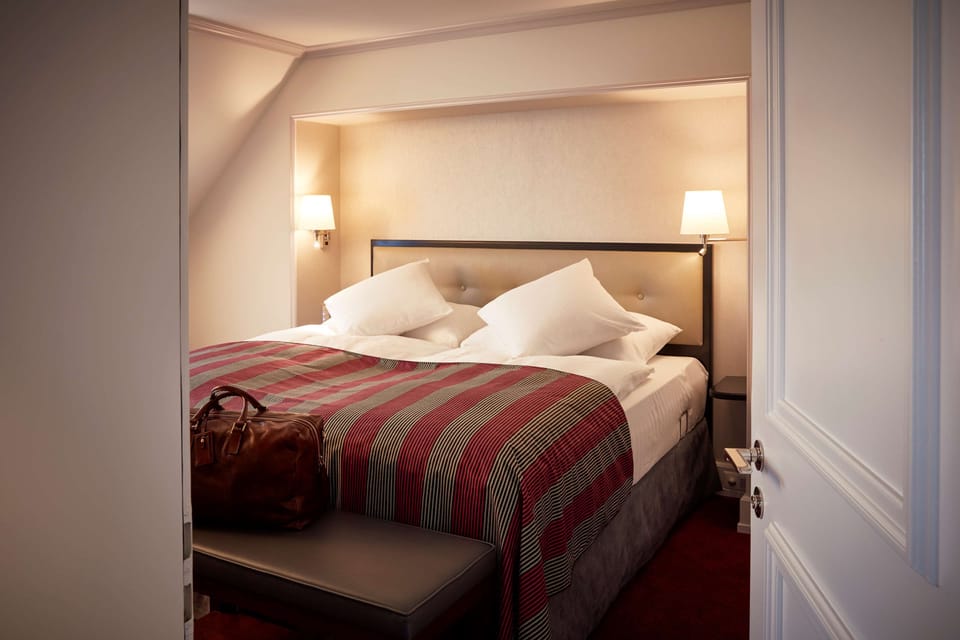 Premium bedding, free minibar items, in-room safe, desk