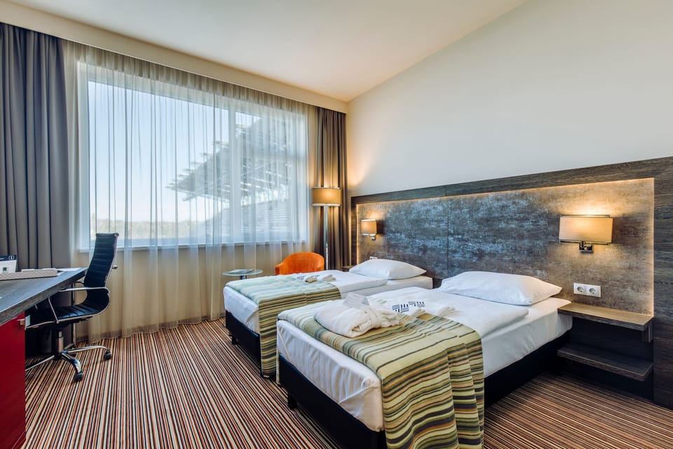 Superior Twin Room (with Stadium View) | Minibar, in-room safe, desk, laptop workspace