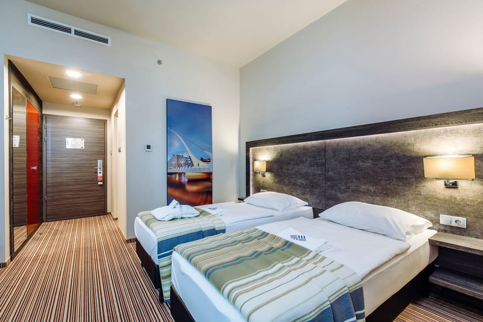 Superior Double room Street View | Minibar, in-room safe, desk, laptop workspace