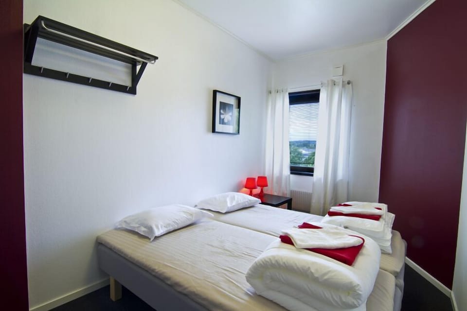 Desk, blackout drapes, WiFi (free), bed sheets