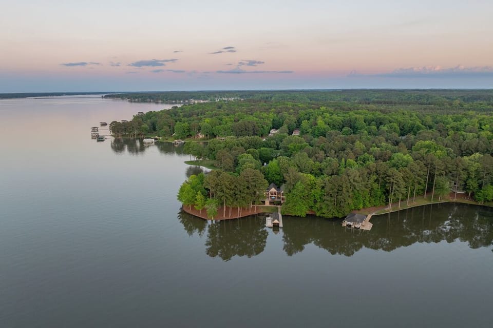 Aerial view showing the house, the main lake and Lysons Creek