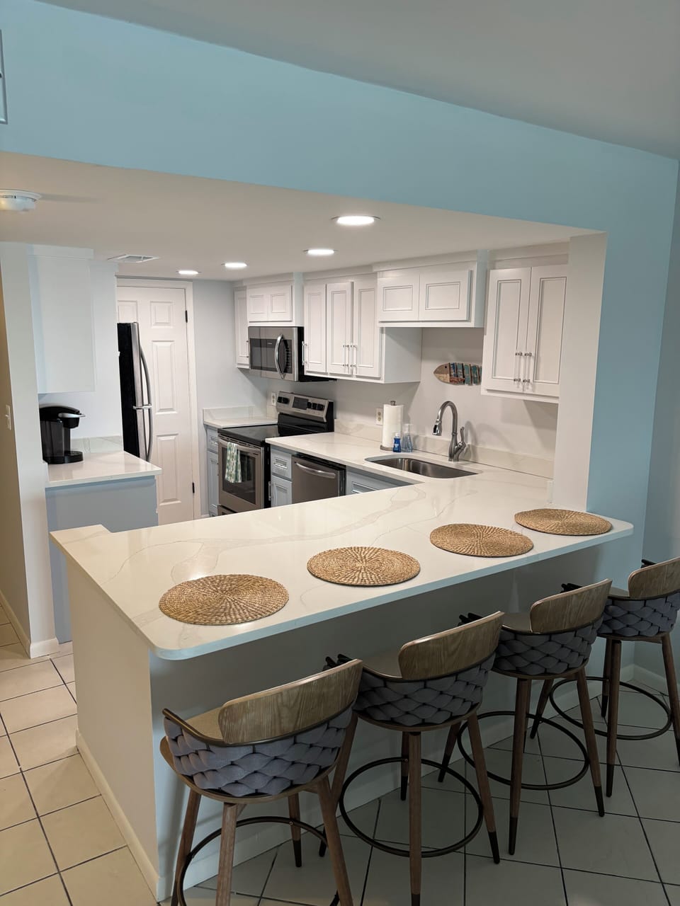 Fully equipped and open kitchen. Enjoy views all the way out to the Gulf!