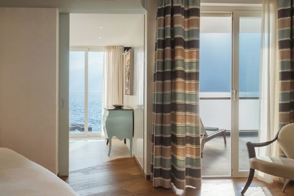 Superior Suite, Lake View | Premium bedding, down comforters, minibar, in-room safe