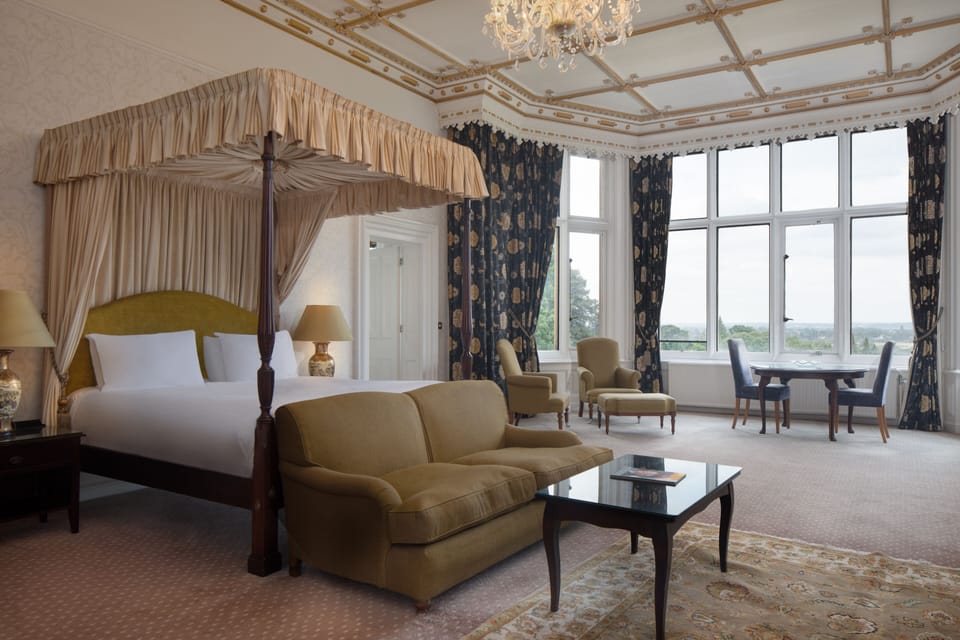 Premium bedding, desk, laptop workspace, iron/ironing board