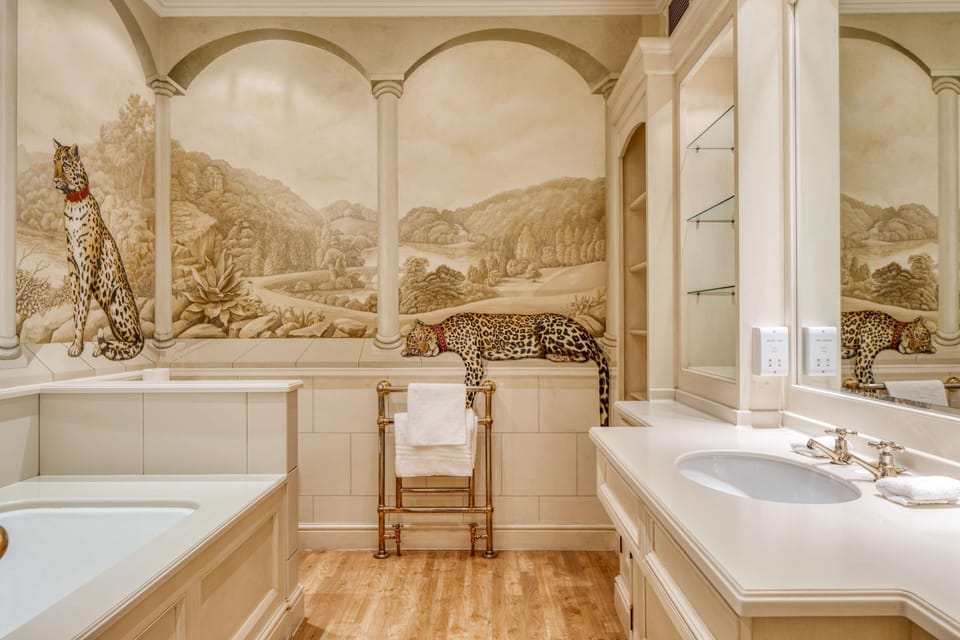 Executive Suite, 1 King Bed, Non Smoking, Garden View (Four Poster Bed;with Sofabed) | Bathroom | Combined shower/tub, rainfall showerhead, free toiletries, hair dryer