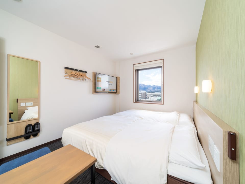 Desk, laptop workspace, free WiFi, bed sheets