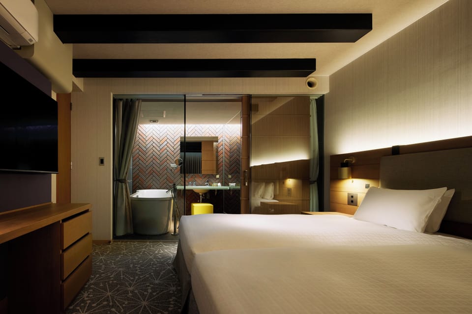 Newly Renovated Junior Suite  Non-Smoking (Dec 2025) | Bathroom | Combined shower/tub, hair dryer, slippers, bidet