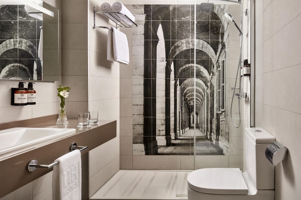 Rainfall showerhead, eco-friendly toiletries, hair dryer, slippers