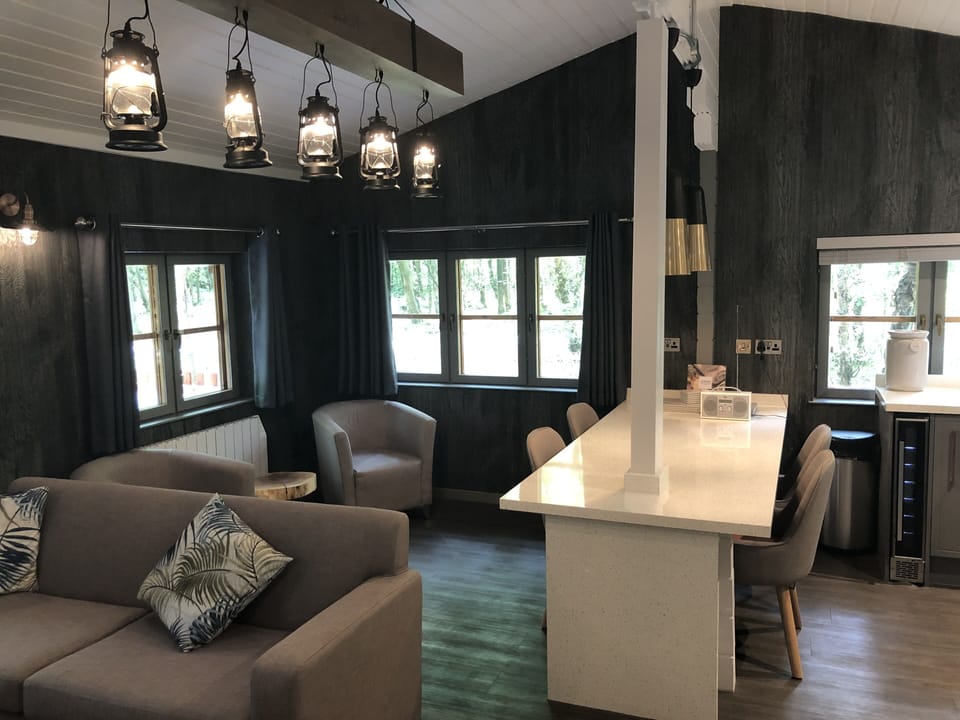 Woodland Lodge, Hot Tub | Living area | 32-inch flat-screen TV with digital channels, TV