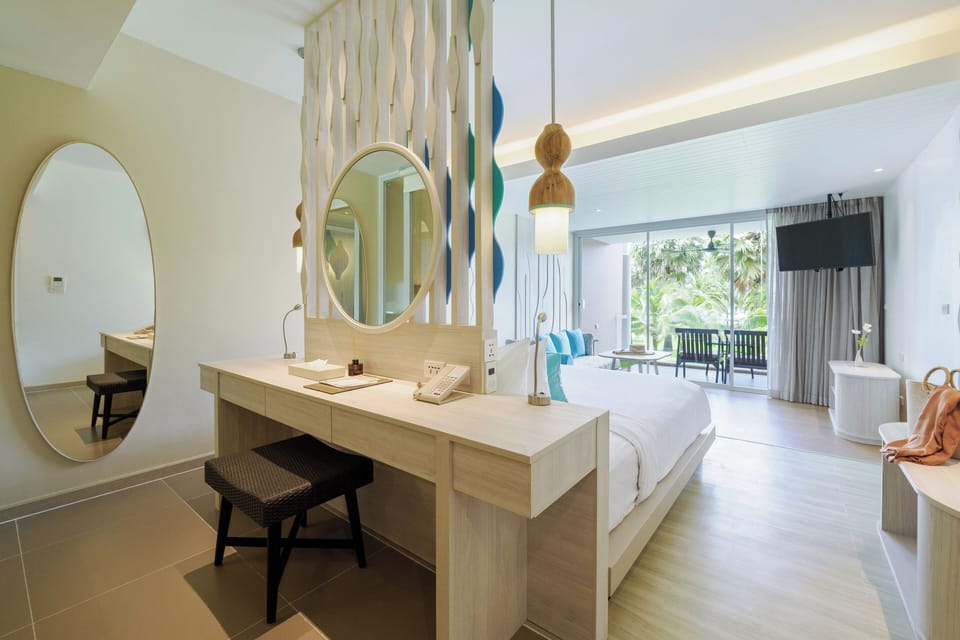 Junior Suite, Side Sea View | Minibar, in-room safe, individually furnished, desk