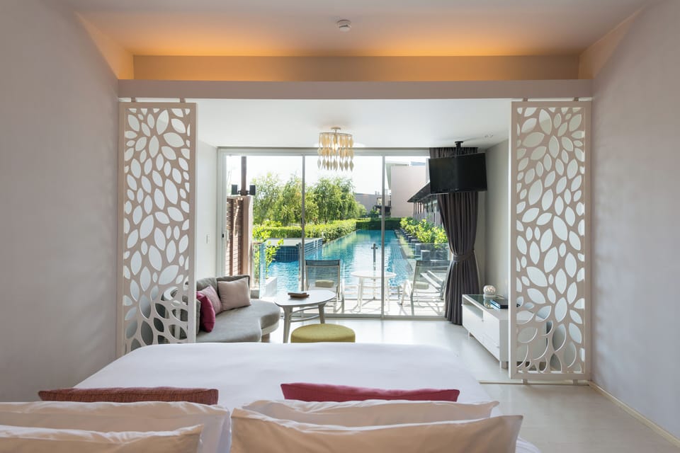 Junior Suite, Pool Access | Minibar, in-room safe, individually furnished, desk