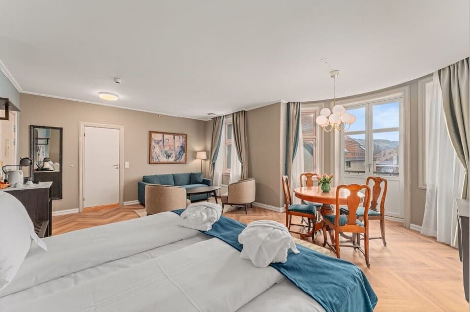 Suite | Premium bedding, desk, laptop workspace, blackout drapes