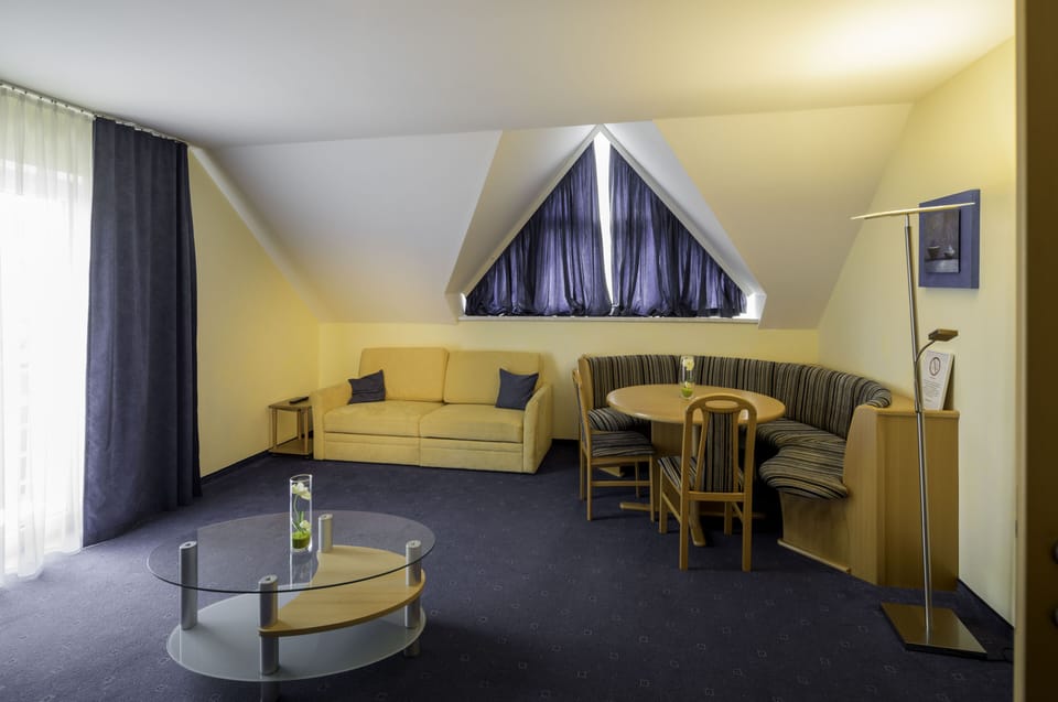 Basic Apartment | Living area | 32-inch flat-screen TV with satellite channels, TV, heated floors