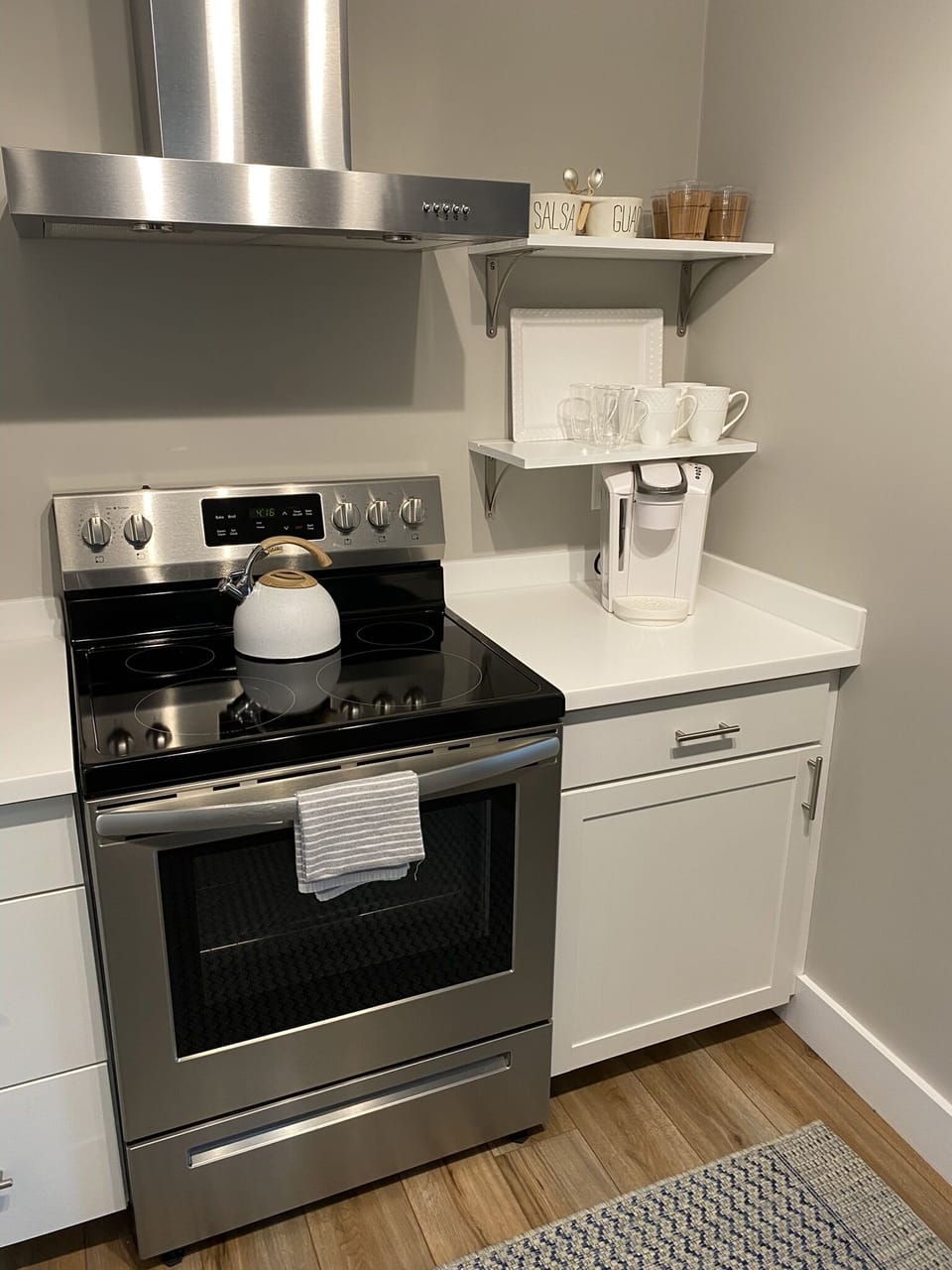 Coffee station with Keurig Coffee Maker and Tea Pot.