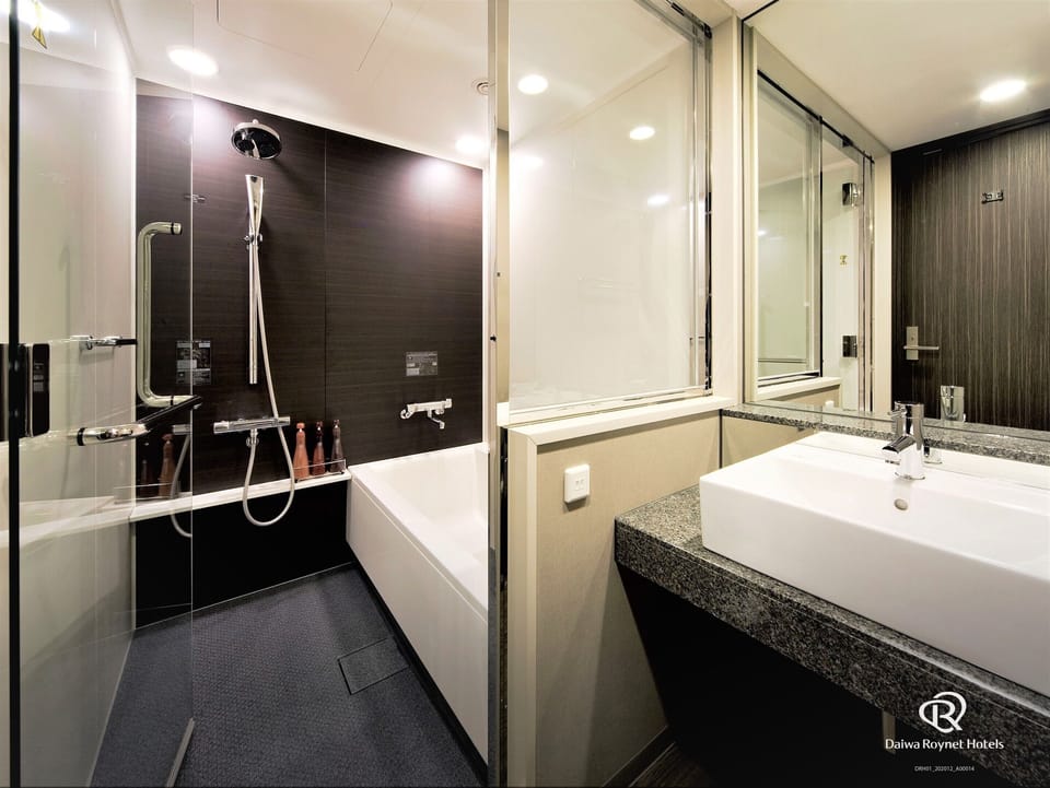 Shower, free toiletries, hair dryer, slippers