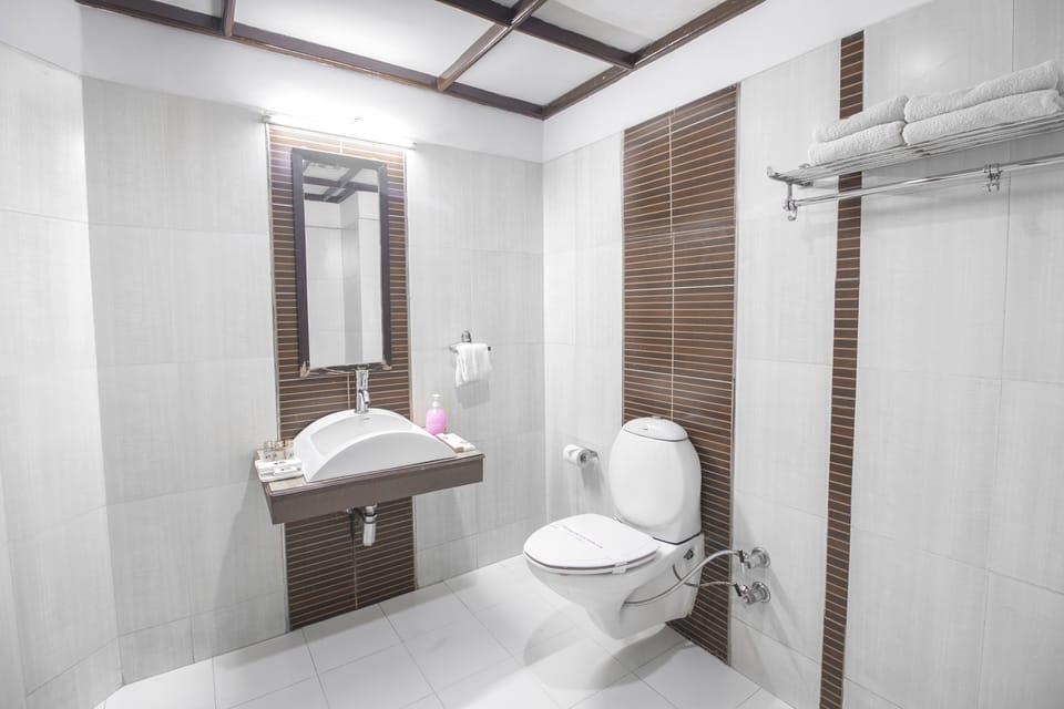 Shower, hair dryer, slippers, towels
