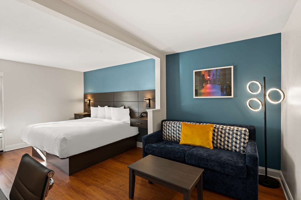 Junior Suite, 1 King Bed, Non Smoking (with Sofabed) | Pillowtop beds, desk, laptop workspace, iron/ironing board