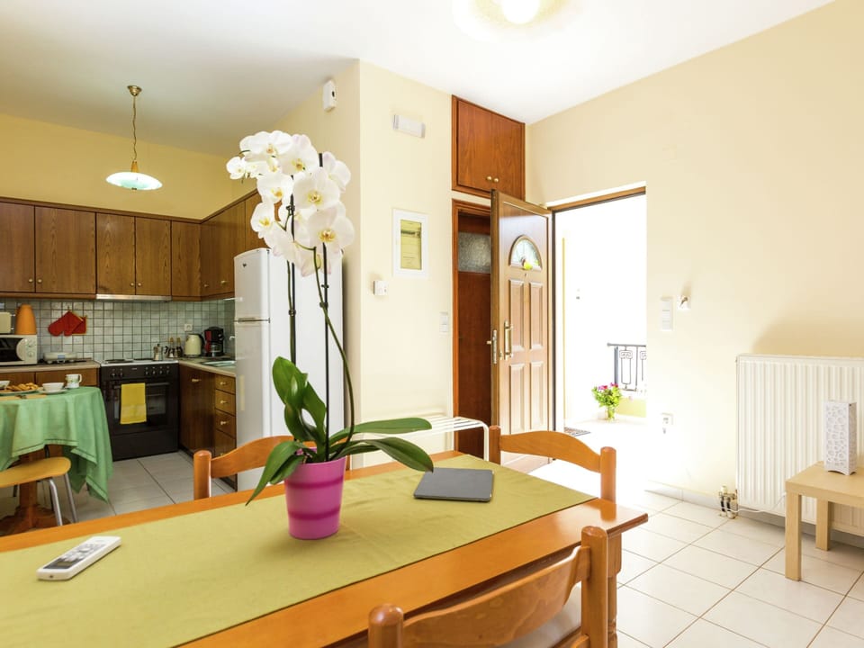 Apartment | Private kitchen | Electric kettle, dining tables