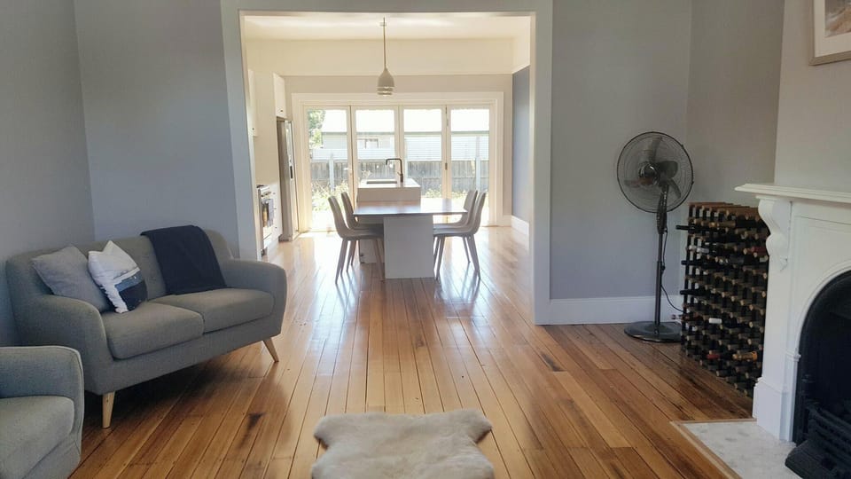 Hardwood flooring enhances the charm of this bright, open layout.