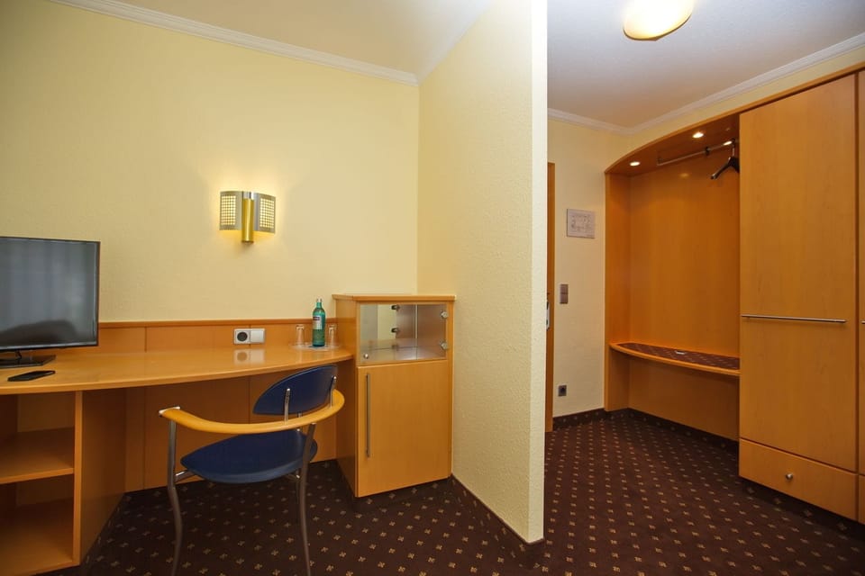 Desk, iron/ironing board (on request), bed sheets