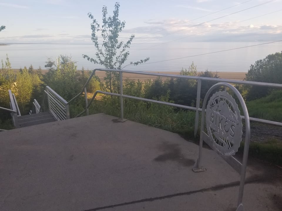 The steps down to the Kenai beach are a five minute walk from the property.