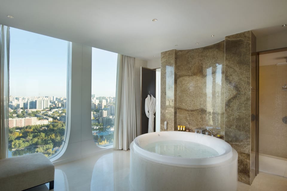 1 King Presidential Suite | Bathroom | Separate tub and shower, hydromassage showerhead, designer toiletries