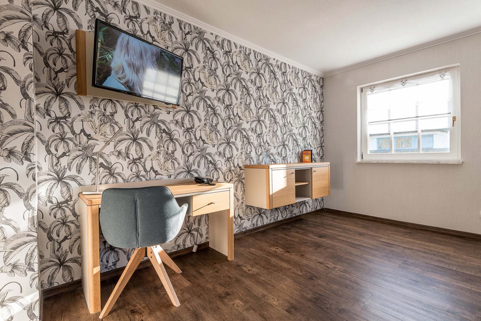 Comfort Double Room | Living area | TV, heated floors