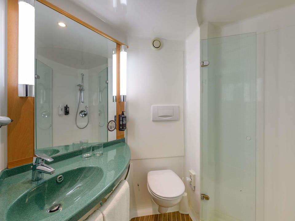 Shower, eco-friendly toiletries, hair dryer, towels