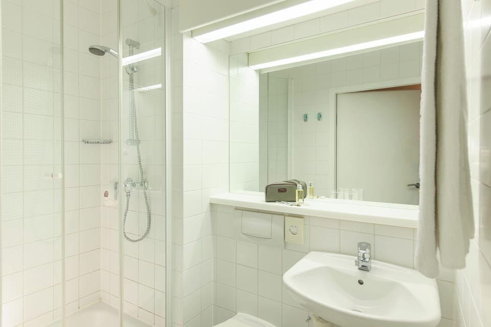 Shower, eco-friendly toiletries, hair dryer, towels