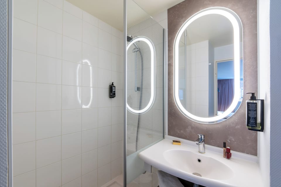 Shower, eco-friendly toiletries, hair dryer, towels